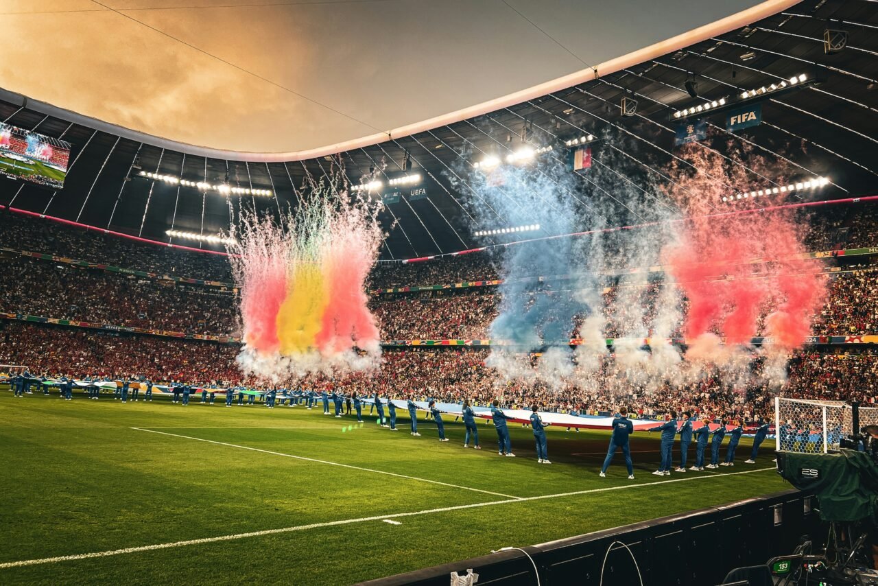 World Cup 2026: teams line up on the pitch before kick-off as pyrotechnics light up a packed stadium
