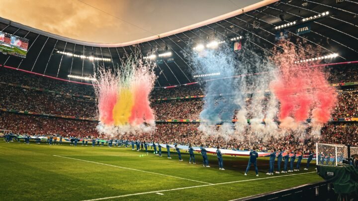 World Cup 2026: teams line up on the pitch before kick-off as pyrotechnics light up a packed stadium